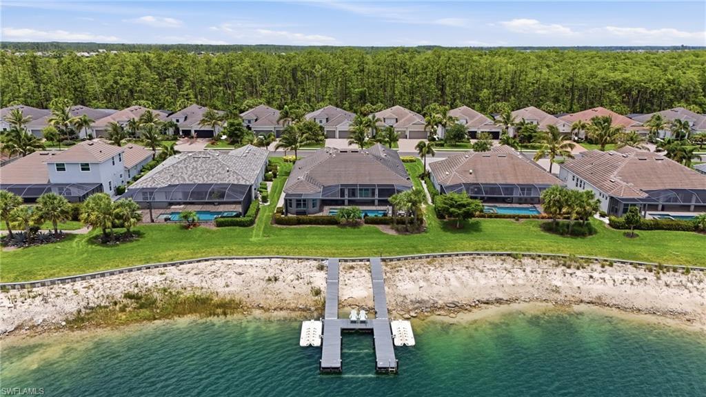 Waterfront community with private dock access and lush green spaces