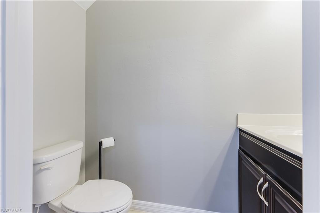 Bathroom with vanity and baseboards