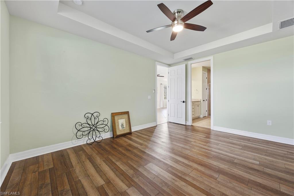 Primary bedroom featuring vinyl flooring