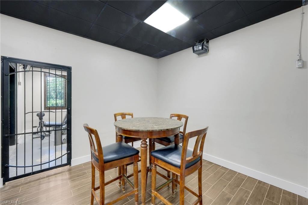 Sitting area in Speakeasy/Entertaining Room with private wine room