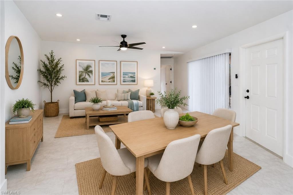 Open-concept living and dining area featuring light-toned tile flooring, recessed lighting, and a modern ceiling fan