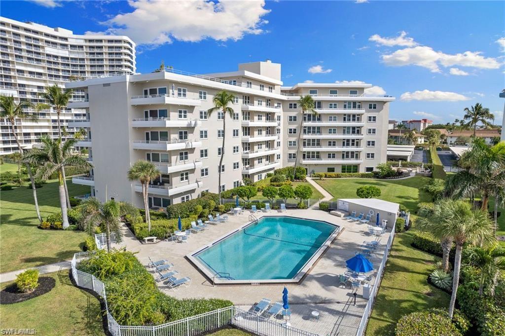 View of pool with a yard