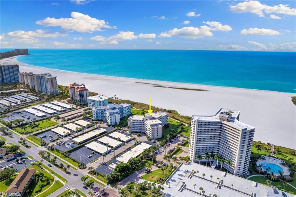 Drone / aerial view featuring a view of the beach and a water view
