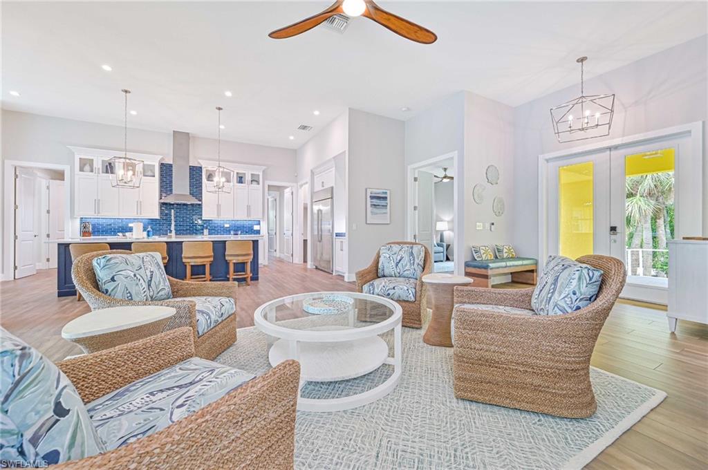 Open-concept living area with wood-finish flooring