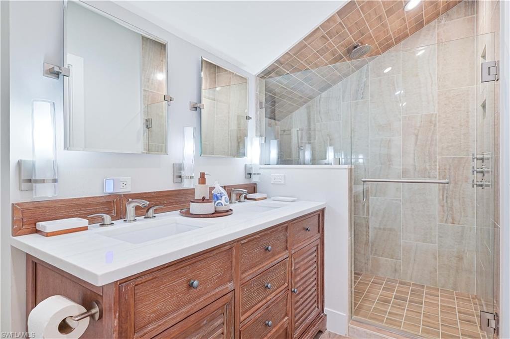 Dual vanity with a white countertop and individual rectangular sinks
