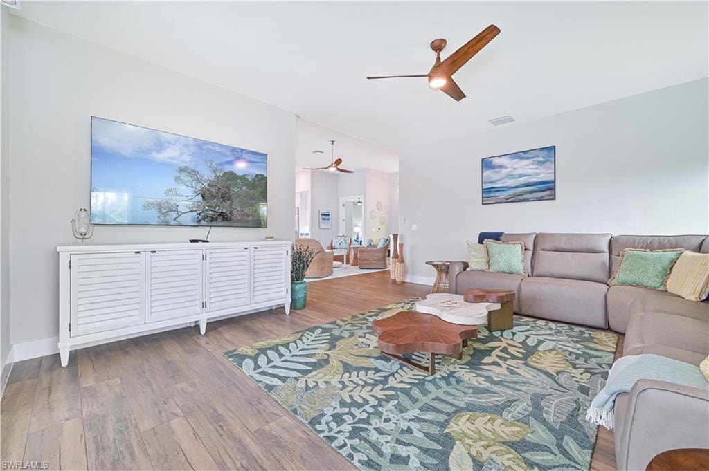 Spacious living area featuring wood-finish flooring throughout