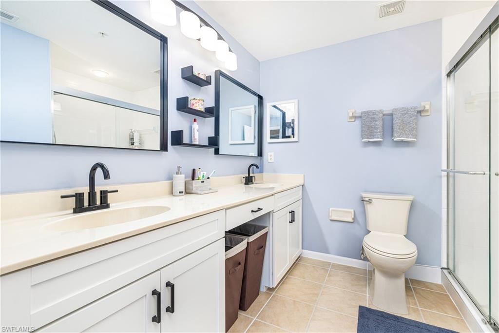 Dual vanity with undermount sinks and matte black fixtures