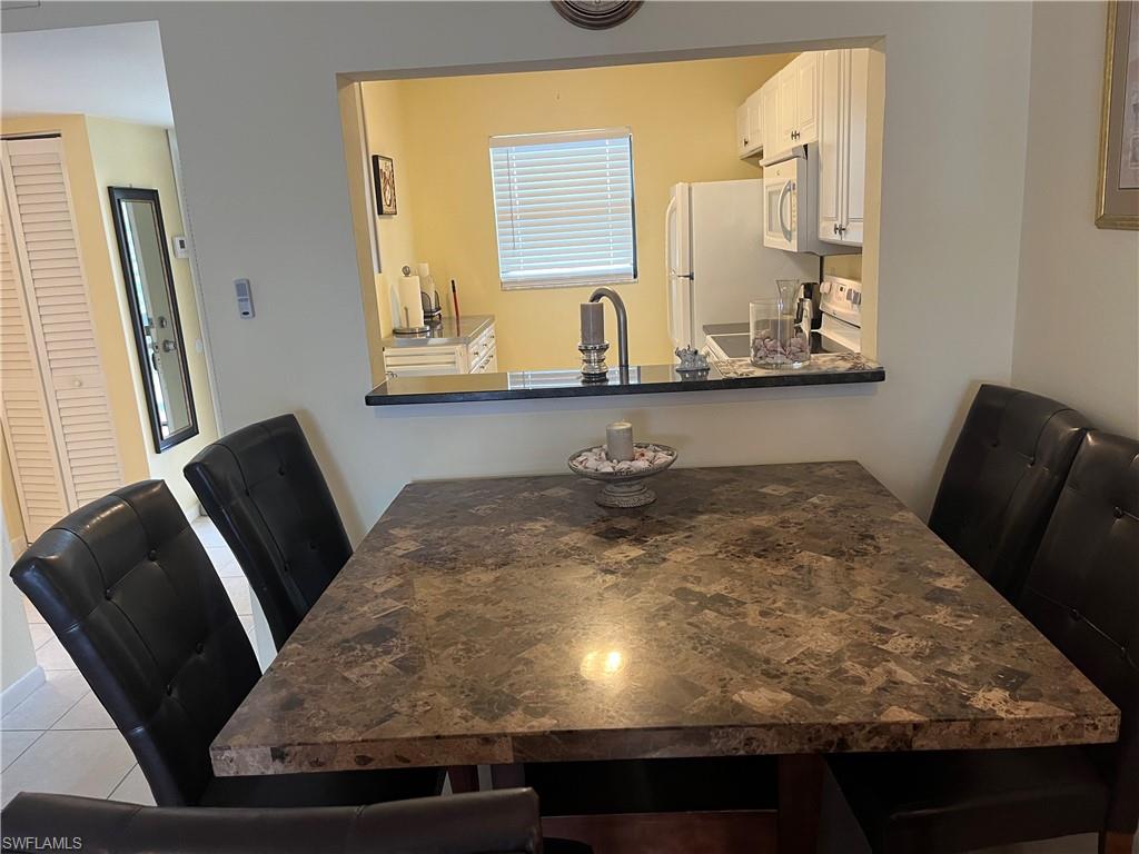 Dining area featuring tile patterned floors