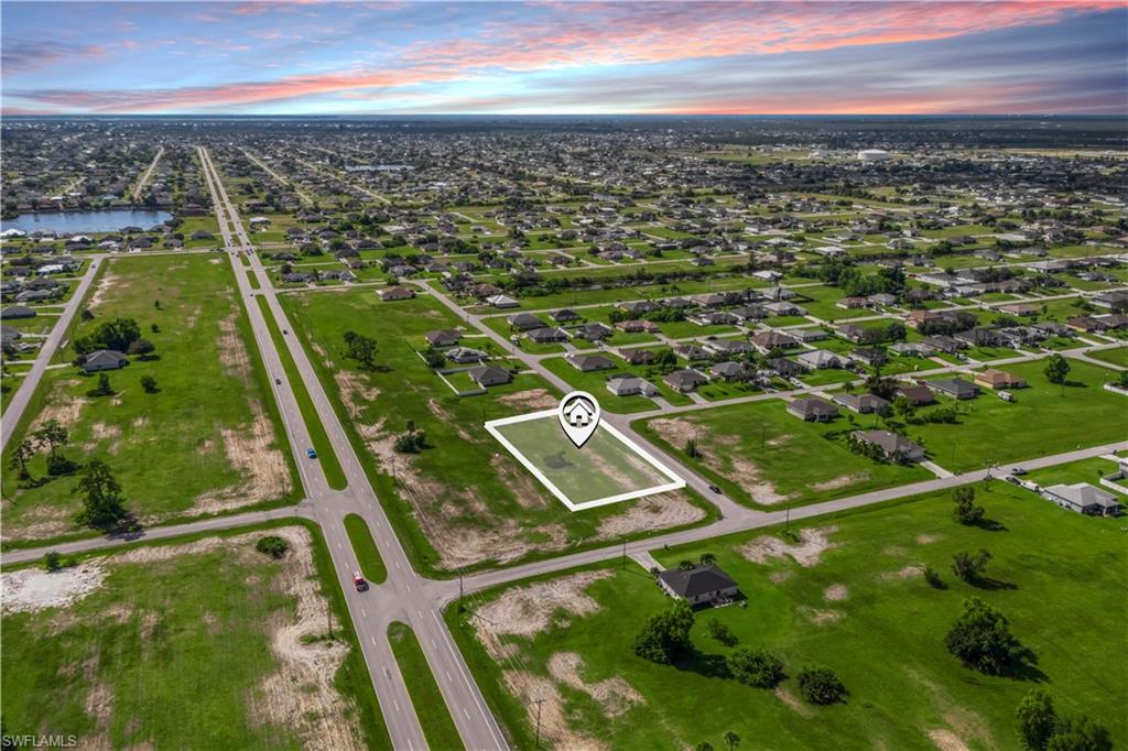 Clean shot of the quiet residential street leading to the property — welcoming and peaceful setting in NW Cape Coral.