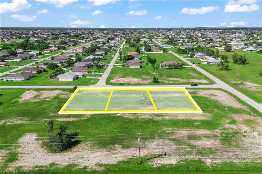 Digital overlay showing the lot lines of the three combined parcels — great visual for buyers to understand the property layout.