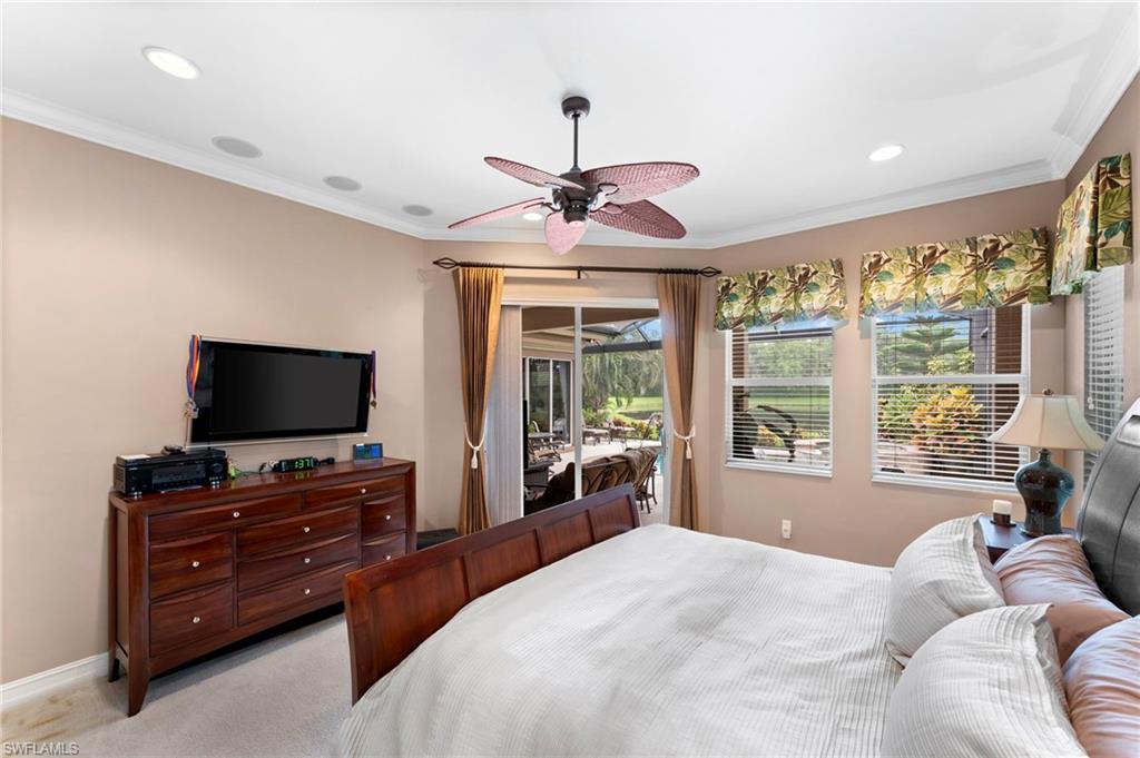 Bedroom featuring crown molding, access to outside, ceiling fan, and light colored carpet
