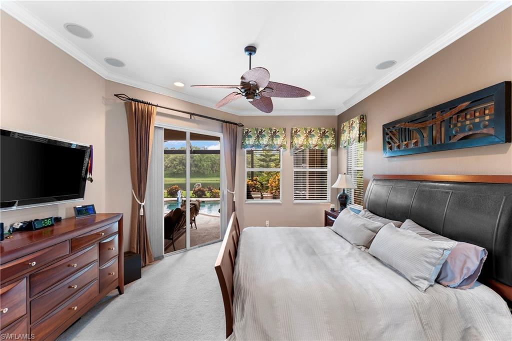 Carpeted bedroom with access to exterior, crown molding, and ceiling fan