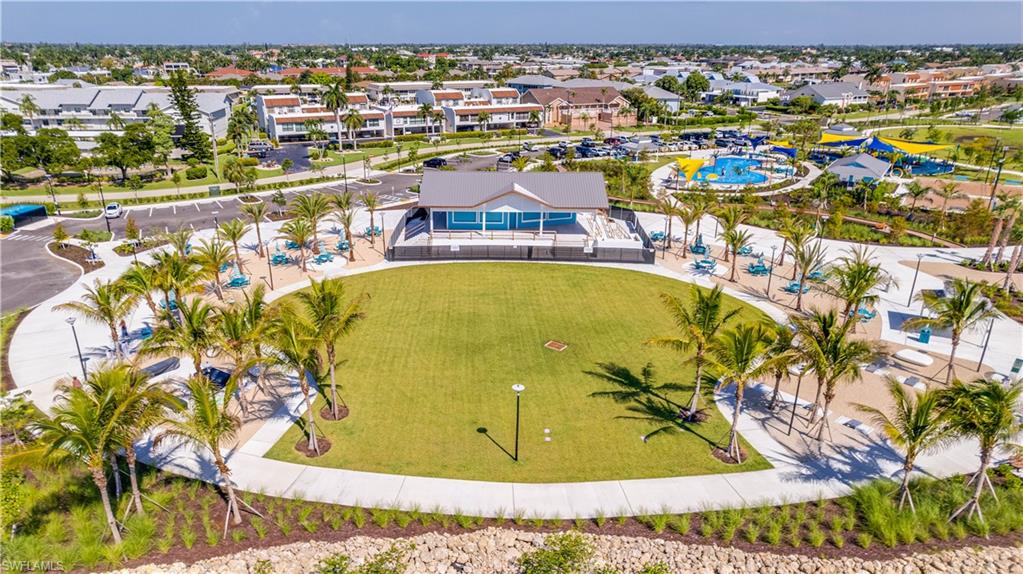 Jaycee Park-Expansive central green space featuring manicured lawn and surrounding paved walkways
