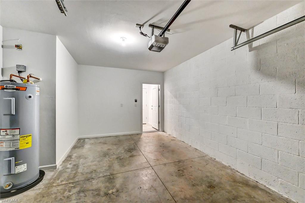 Spacious two-car garage with finished flooring, ample storage potential, and direct interior access — a functional and secure space for vehicles and equipment.