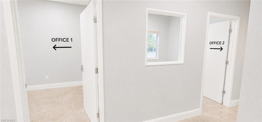 Neutral-toned walls throughout with white baseboards and trim