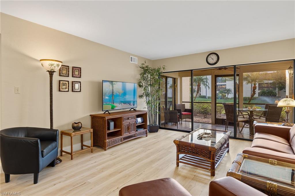 Living room with light hardwood / wood-style floors