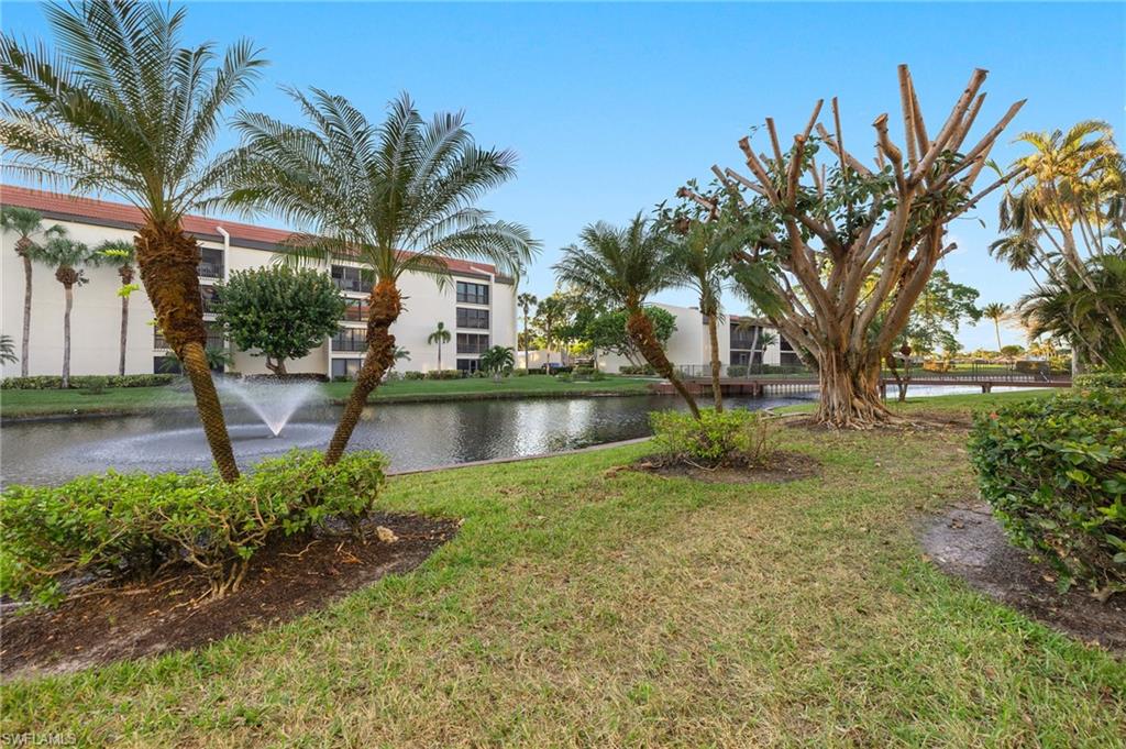 View of yard with a water view