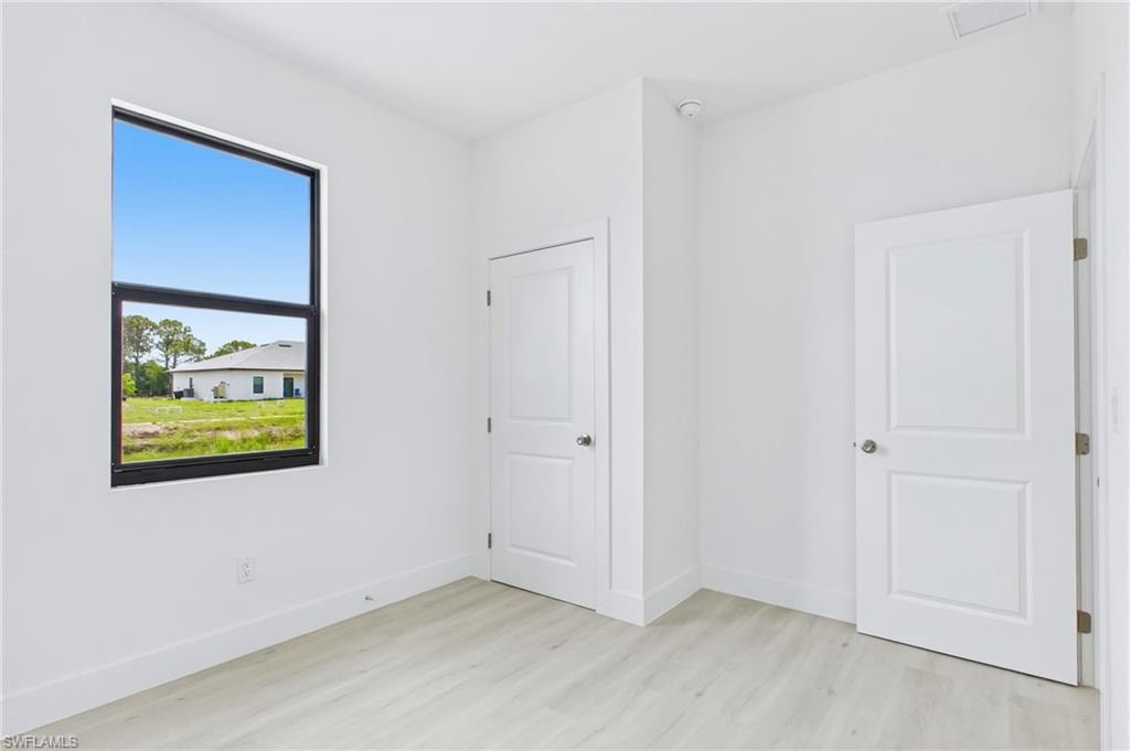 Guest bedroom featuring a peaceful and welcoming atmosphere.