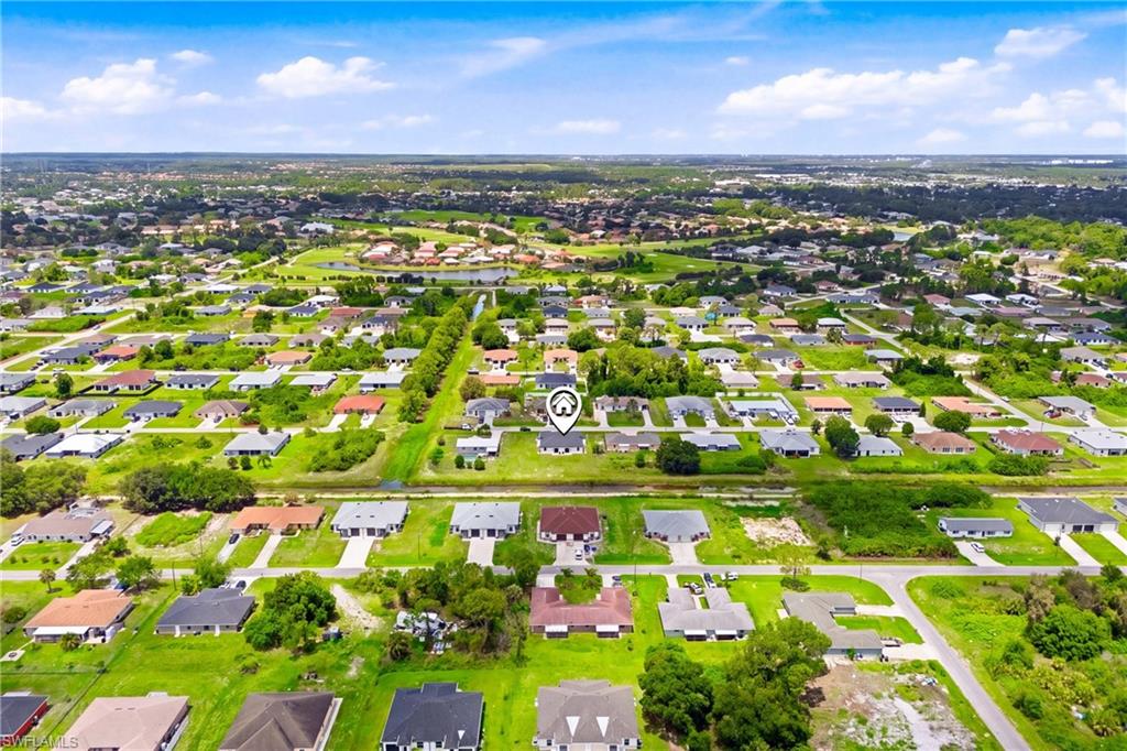 Aerial view of the neighborhood showcasing a quiet, well-maintained residential community.
