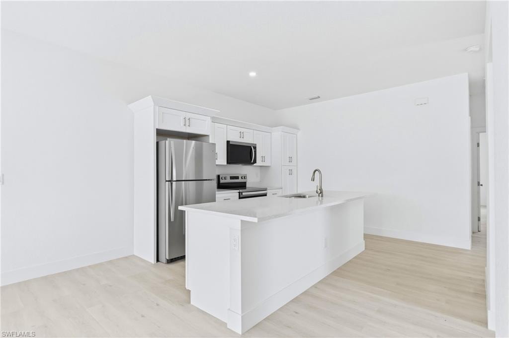 Enjoy effortless entertaining in this spacious living and kitchen area.