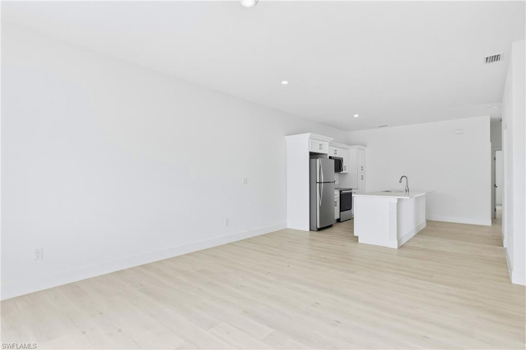Enjoy effortless entertaining in this spacious living and kitchen area.