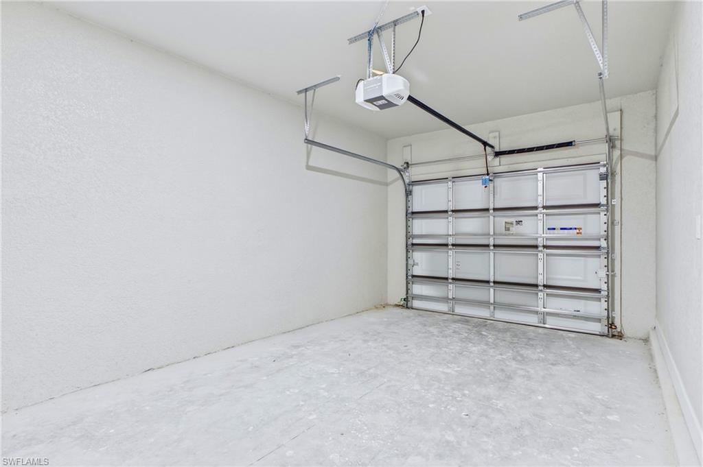 Attached 1-car garage with additional storage space.