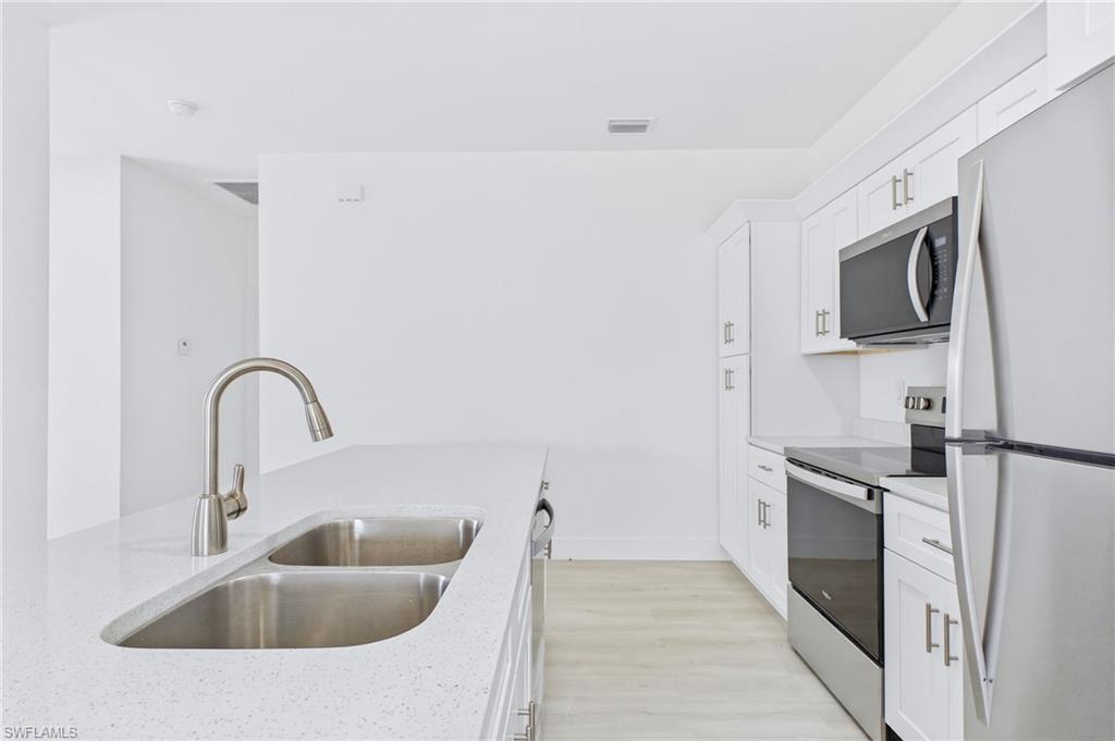 Seamless flow between the kitchen and living room creates the perfect entertaining space.