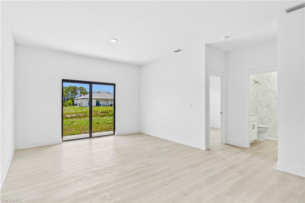 Open and airy living room in Unit 2 perfect for relaxing or entertaining.
