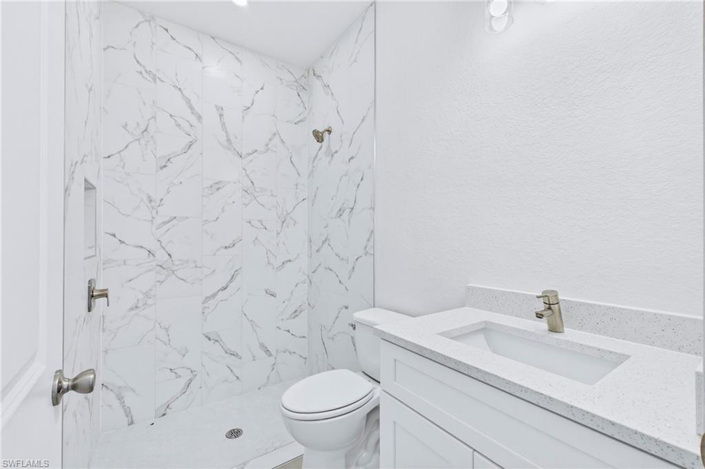 Spacious guest bathroom offering comfort and style for guests.