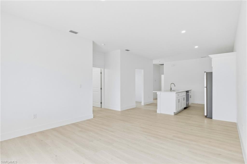 Contemporary living space in the second residence with clean, modern finishes throughout.