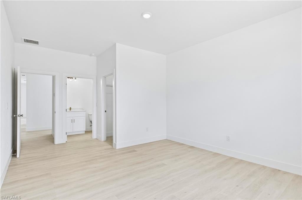 Elegant primary suite featuring a calming and inviting atmosphere.
