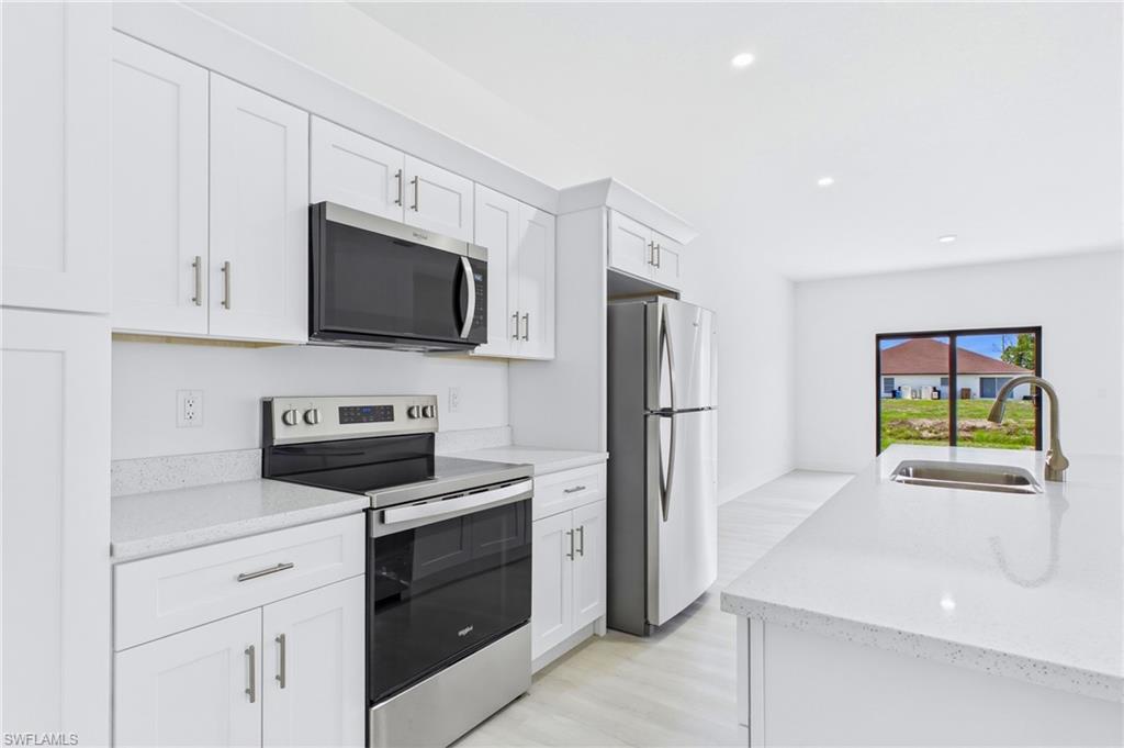 Spacious kitchen in the second residence designed for everyday convenience.