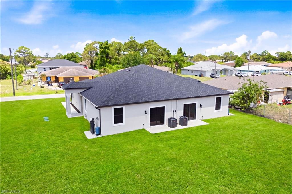 Drone view showcasing the backyard’s privacy and natural surroundings.
