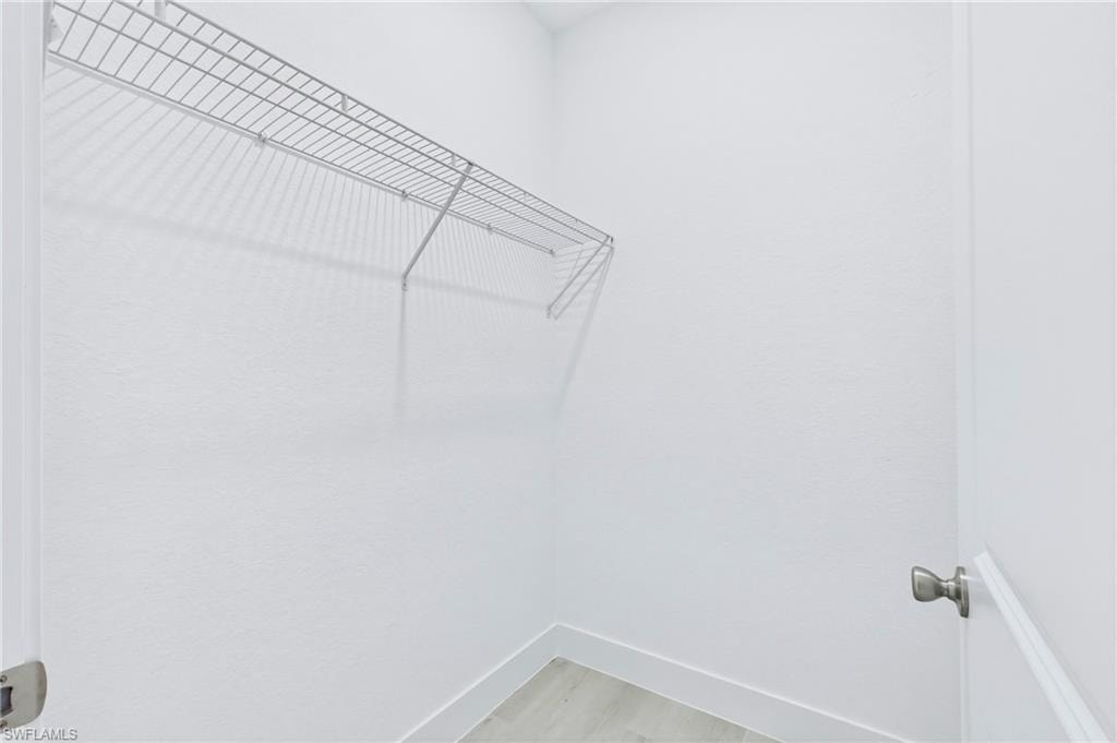 Expansive walk-in closet perfect for organizing clothes and accessories.