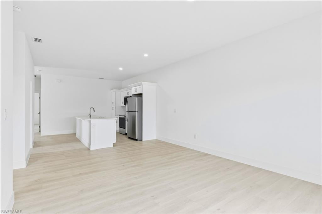 Generous living space in Unit 2 offering a warm and welcoming atmosphere.