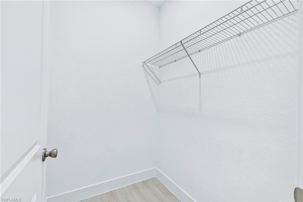 Spacious walk-in closet with ample storage and organization space.