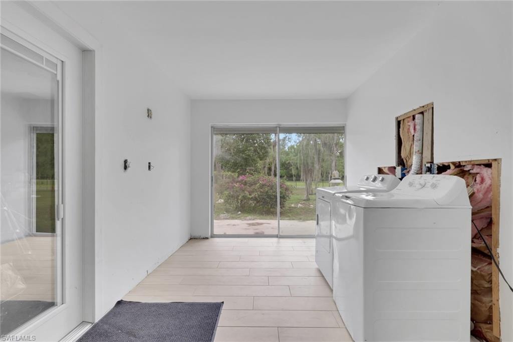 Bright room with tile flooring and sliding glass doors