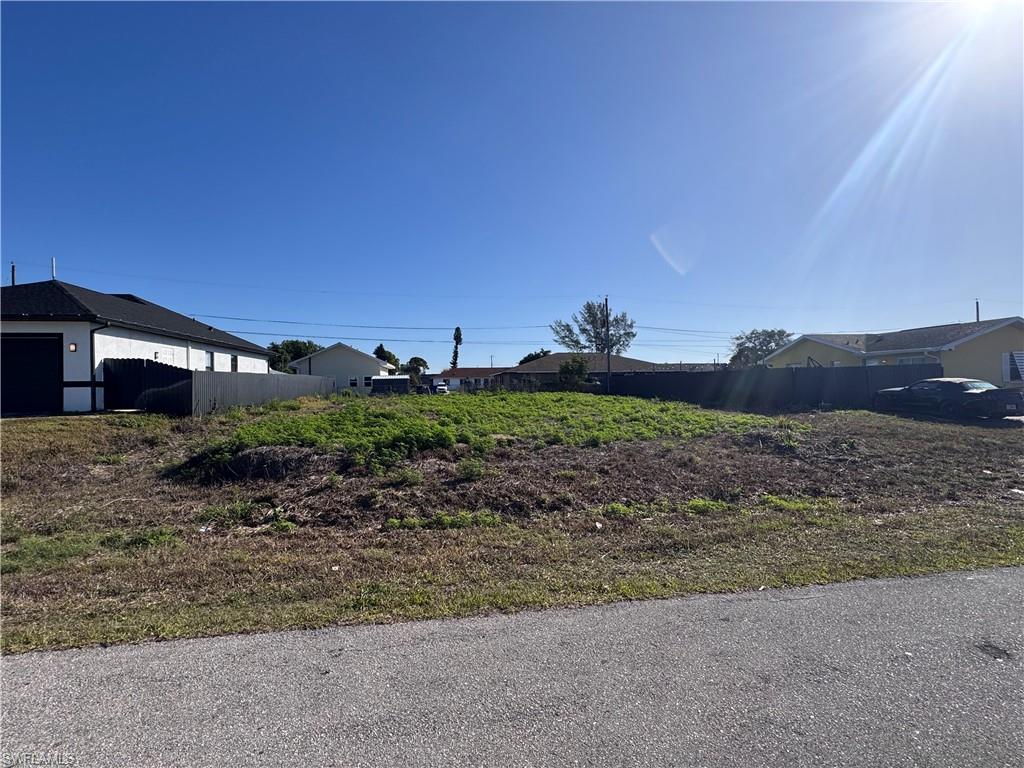 Expansive vacant lot featuring a cleared building envelope and street frontage
