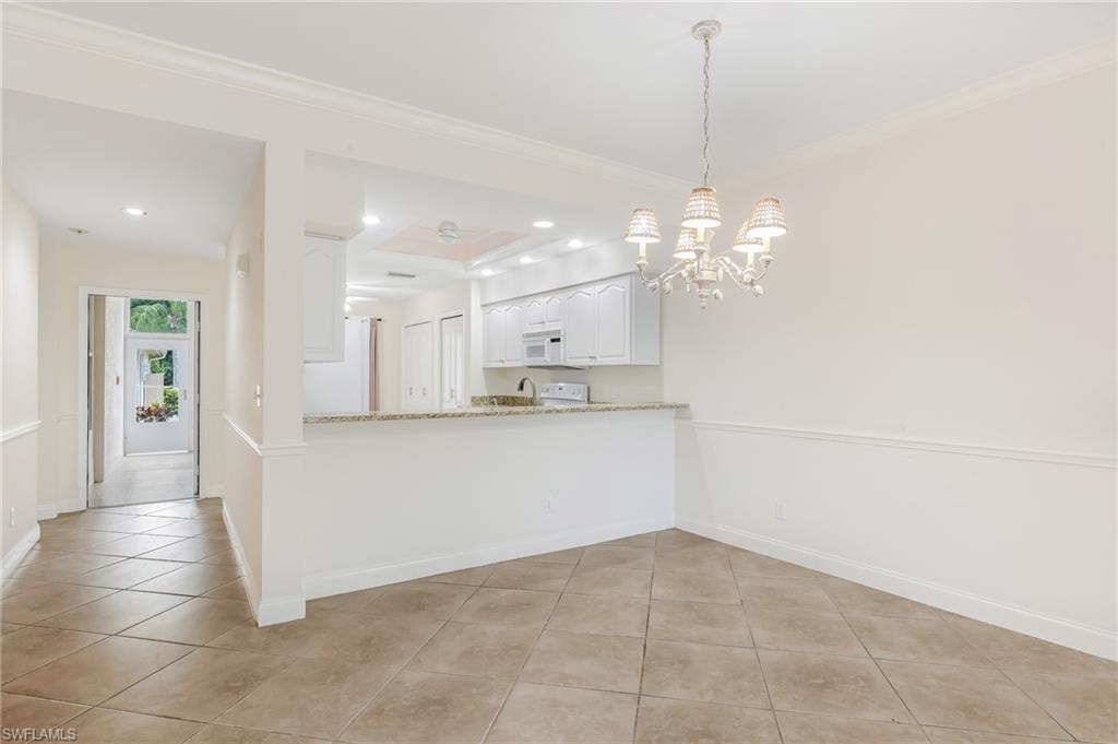 dining area to breakfast bar and kitchen - hall to front door