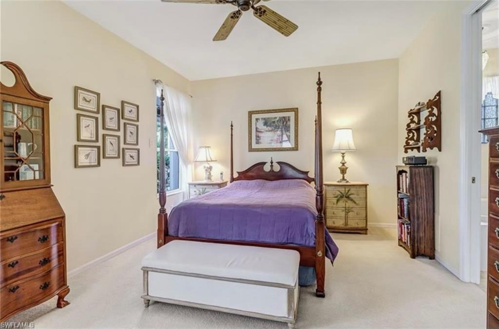 Carpeted bedroom with ceiling fan