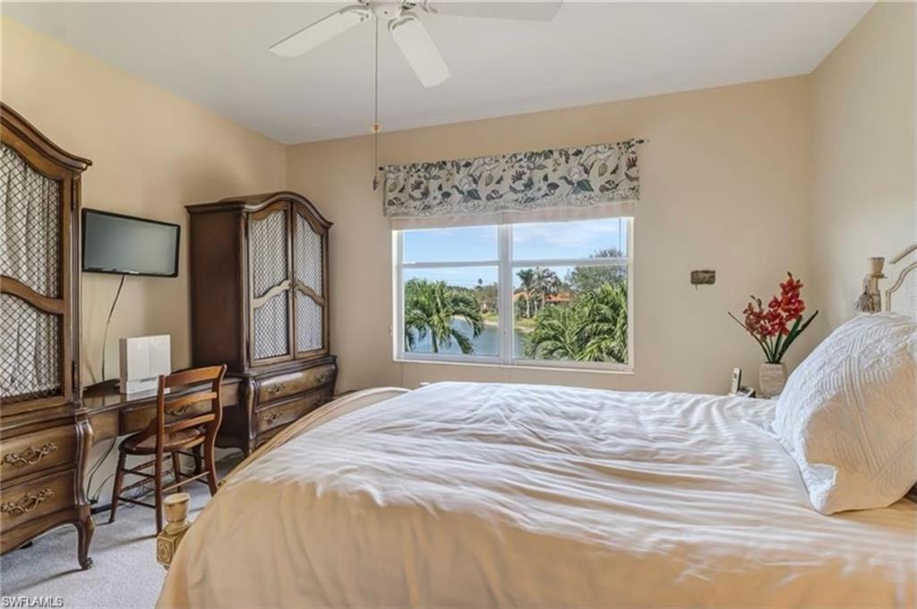 Carpeted bedroom with ceiling fan