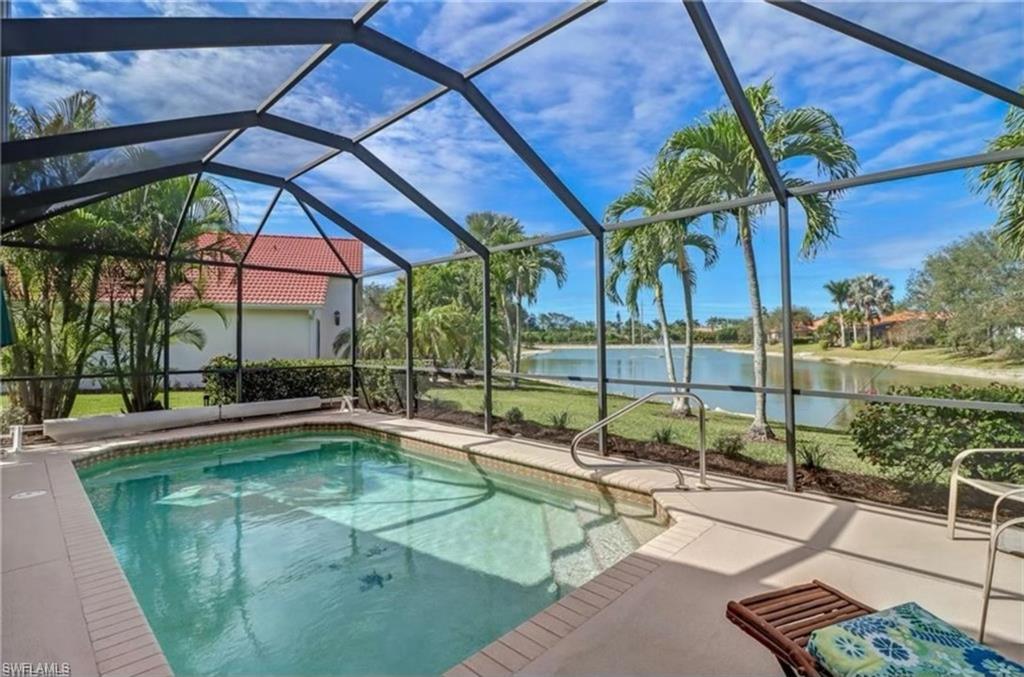 View of pool with a patio, a lanai, and a water view