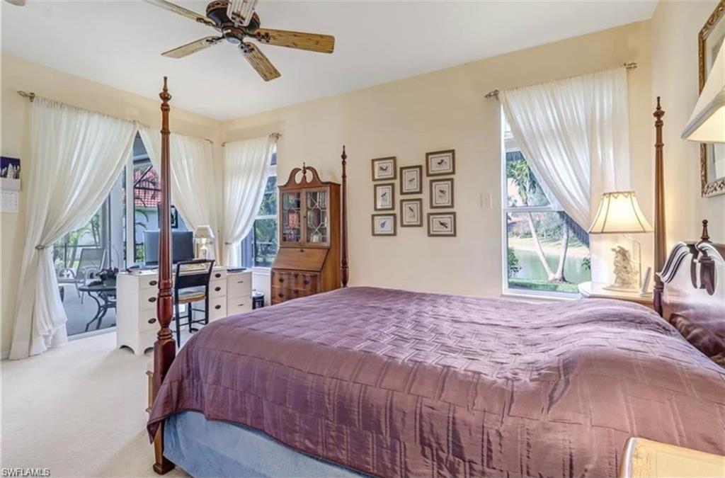 Carpeted bedroom with ceiling fan