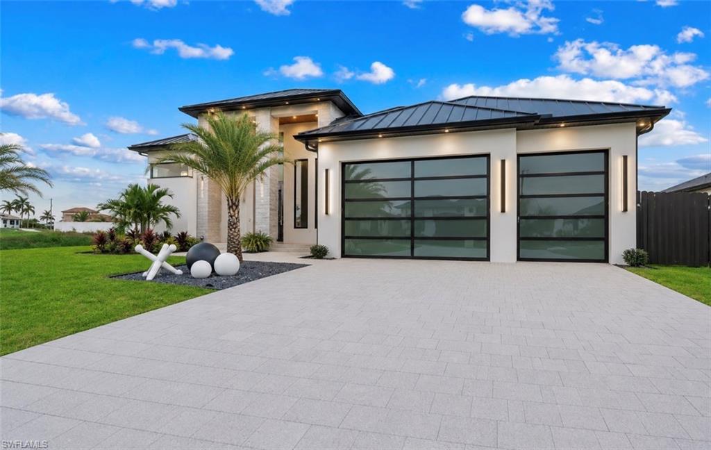 Contemporary exterior with a smooth stucco finish and a dark metal roof
