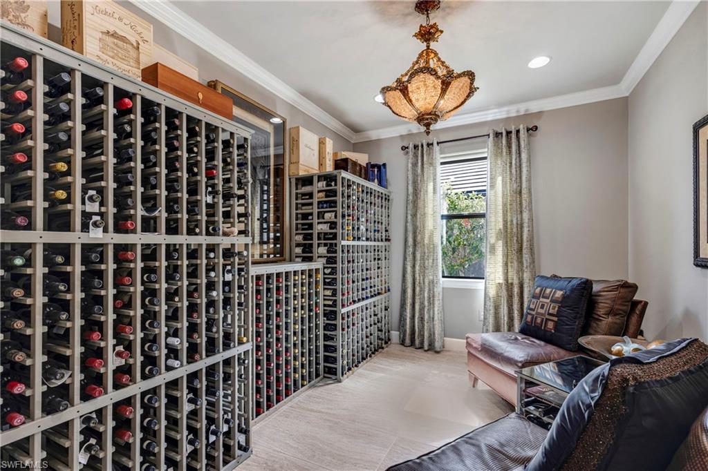Wine cellar with ornamental molding and recessed lighting