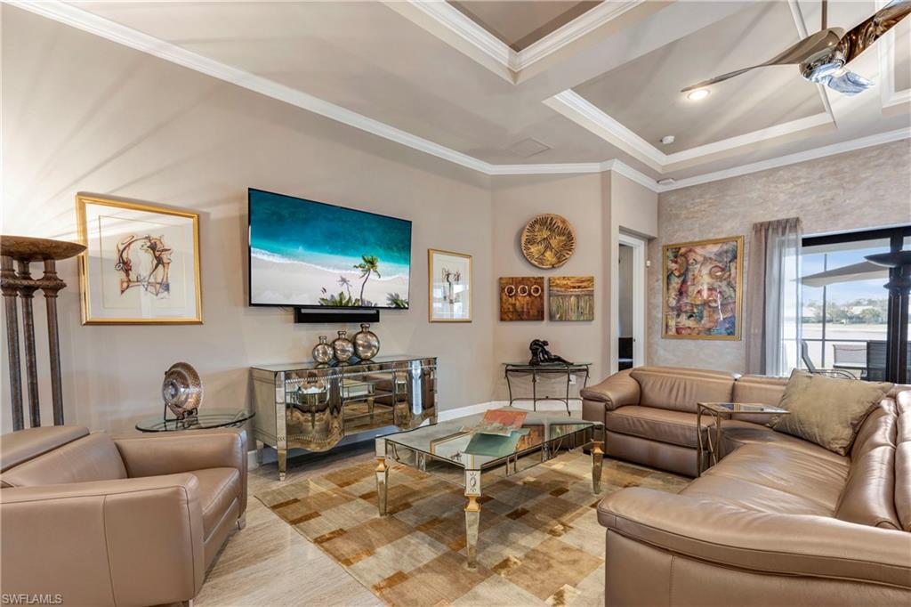 Living room featuring crown molding