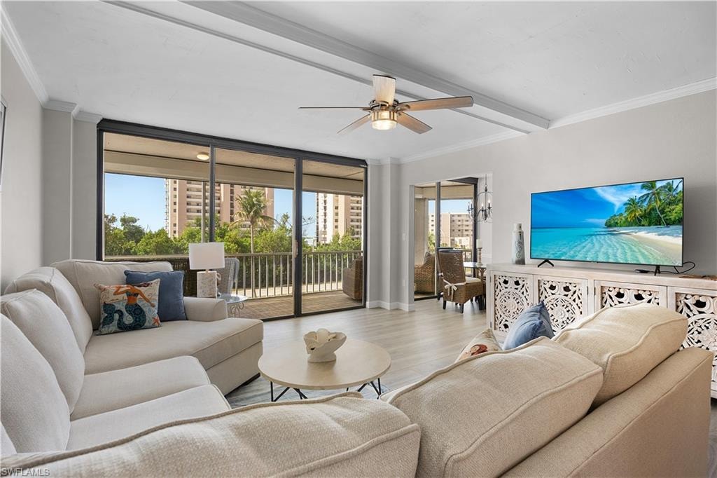 Living area featuring wide plank wood-finish flooring and a ceiling fan