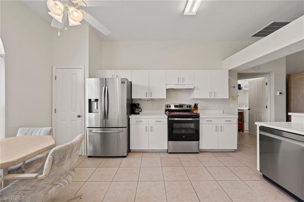 Expansive Kitchen with Stainless Steel Appliances