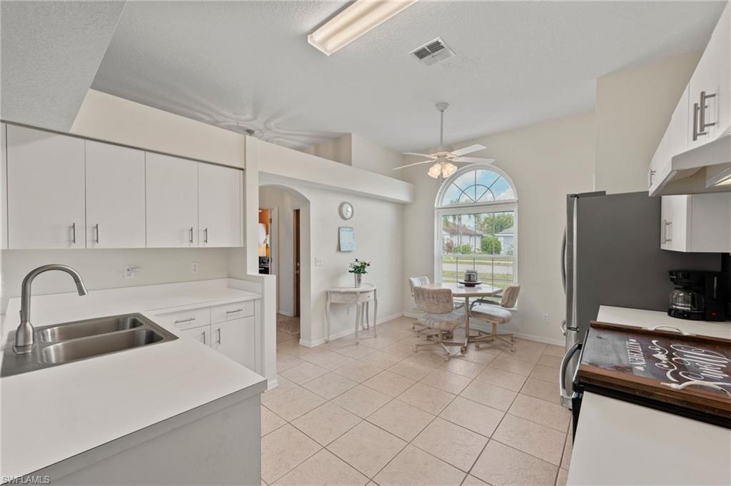 Expansive Kitchen with Stainless Steel Appliances