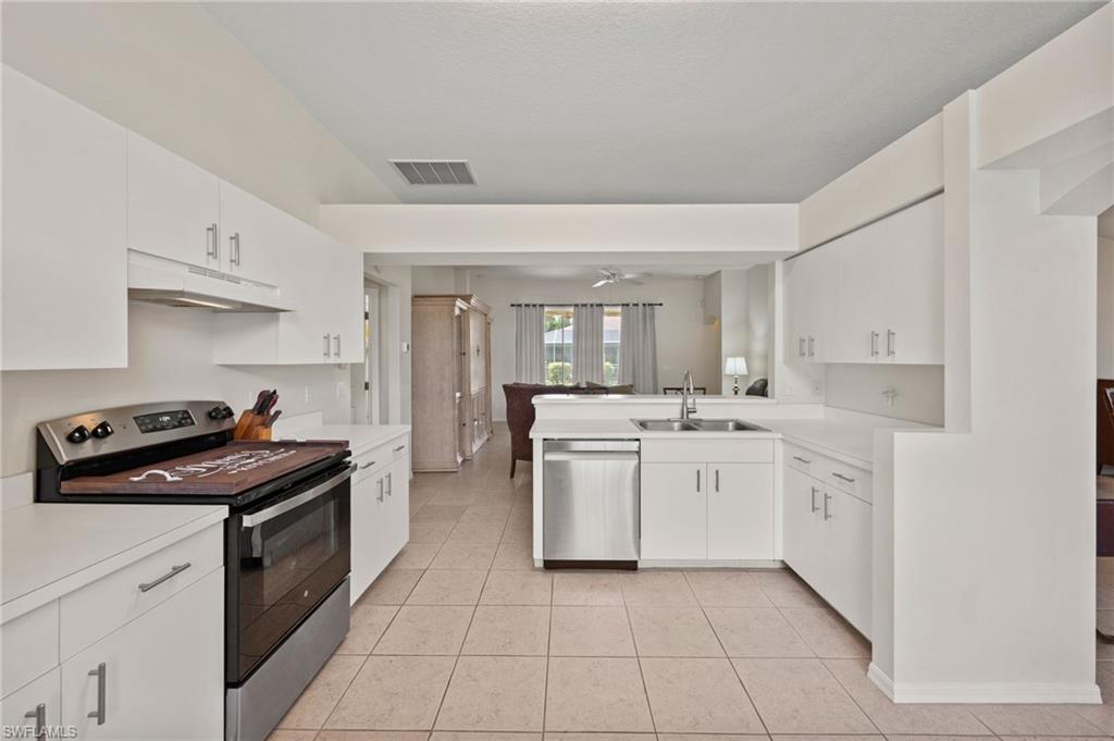 Expansive Kitchen with Stainless Steel Appliances